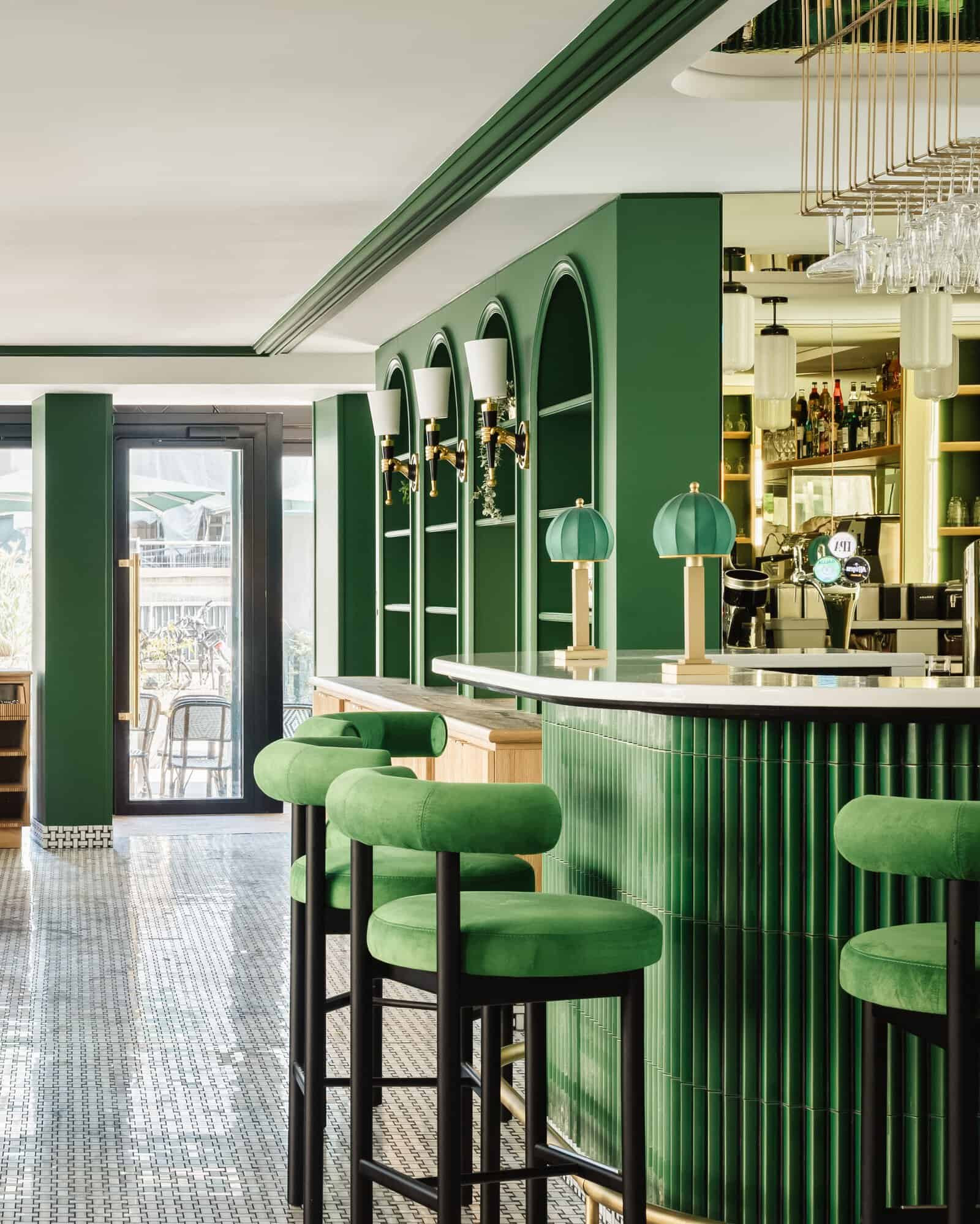 Bar with seating and green-toned décor at Hôtel Observatoire Luxembourg