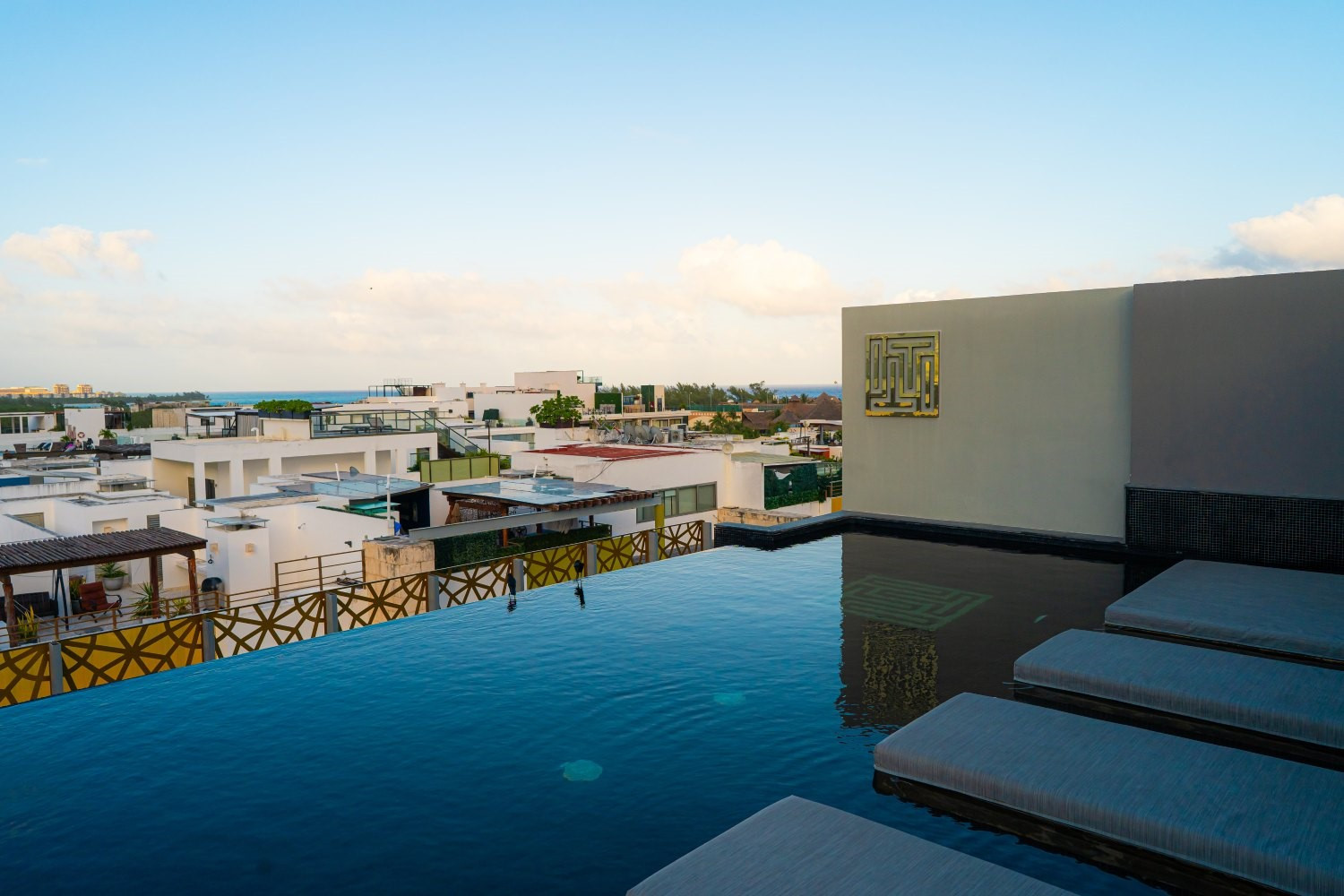 Rooftop with an infinity pool and views of Playa del Carmen and the Caribbean Sea