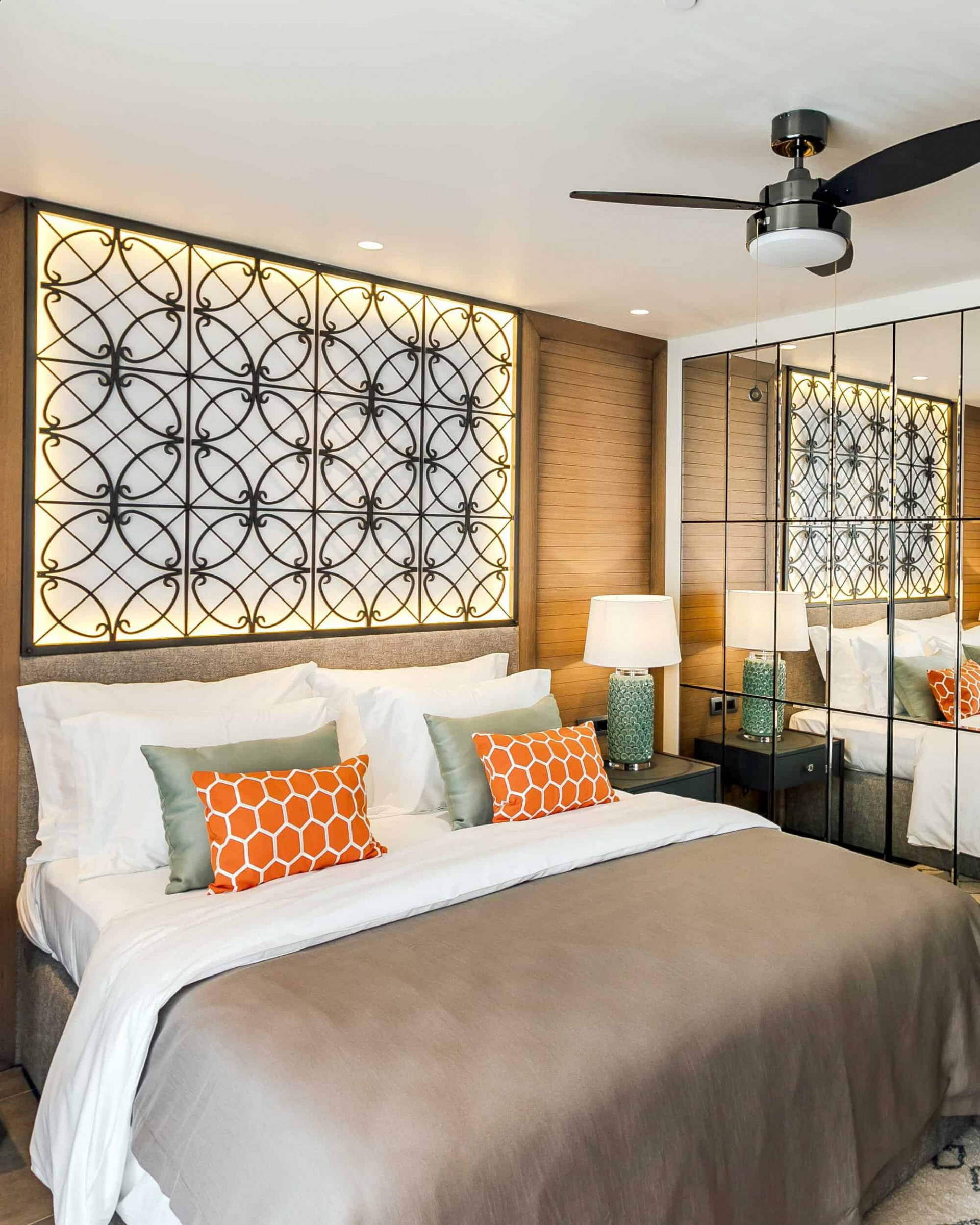 Elegant hotel room with orange and gold tones
