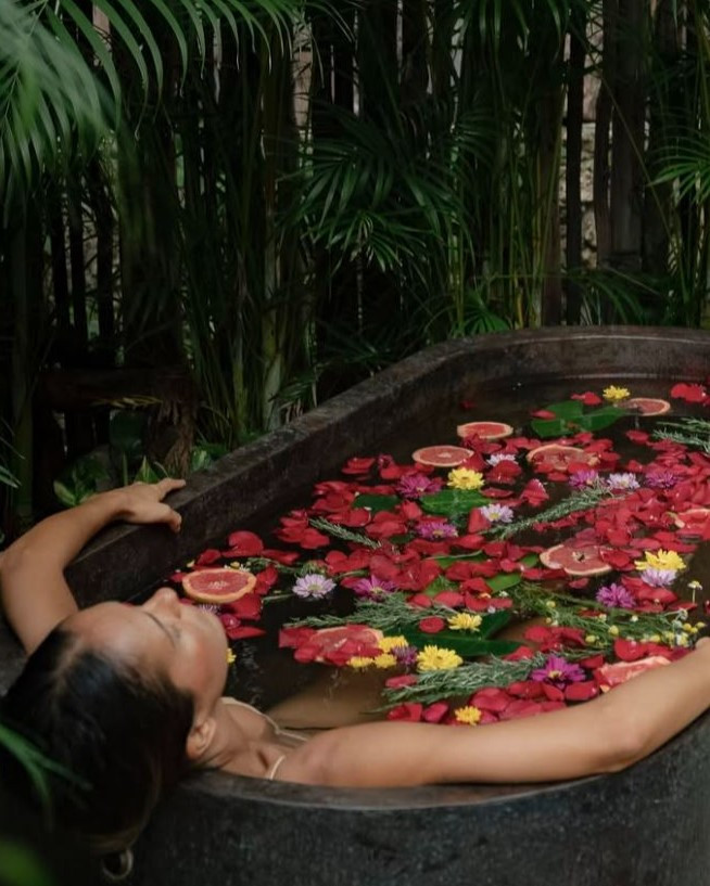 Bath filled with flower and fruit part of the Xunáan Spa experience. 